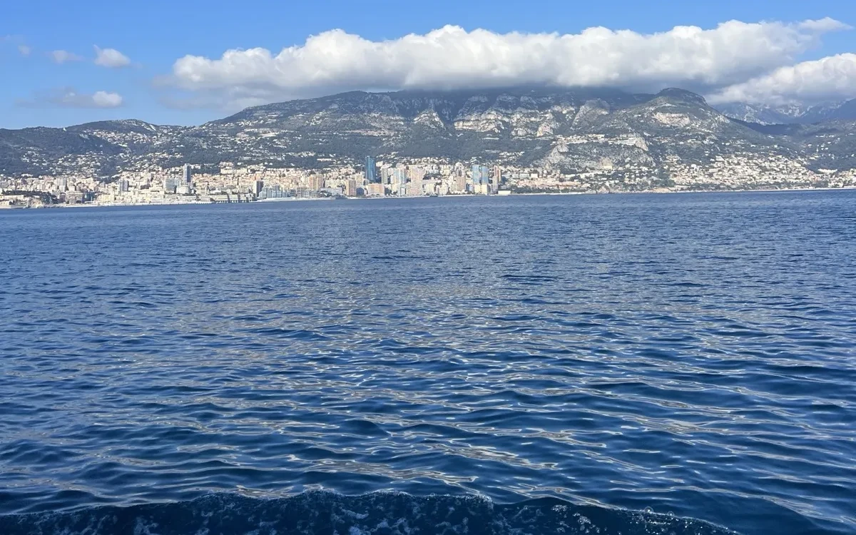 View from a yacht of a convective cloud band along a coastline